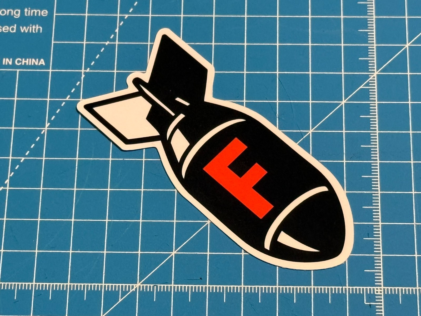 “F Bomb” Black & Orange Vinyl Sticker – Water-Resistant & Tear-Resistant Decal