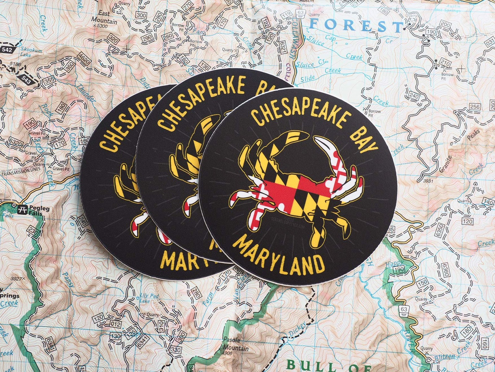 Dark Grey Background With Yellow, Red, White, and Black Crab. Yellow Lettering.
