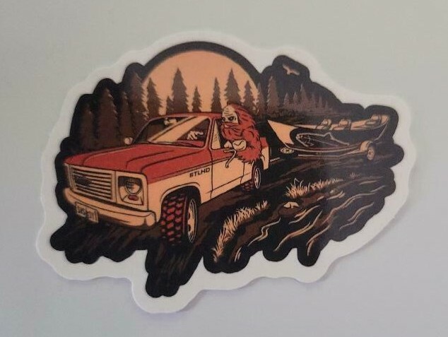 Bigfoot Driving SUV In Forest – Sticker Approx. 1 1/2″ x 2 1/4″ Glossy