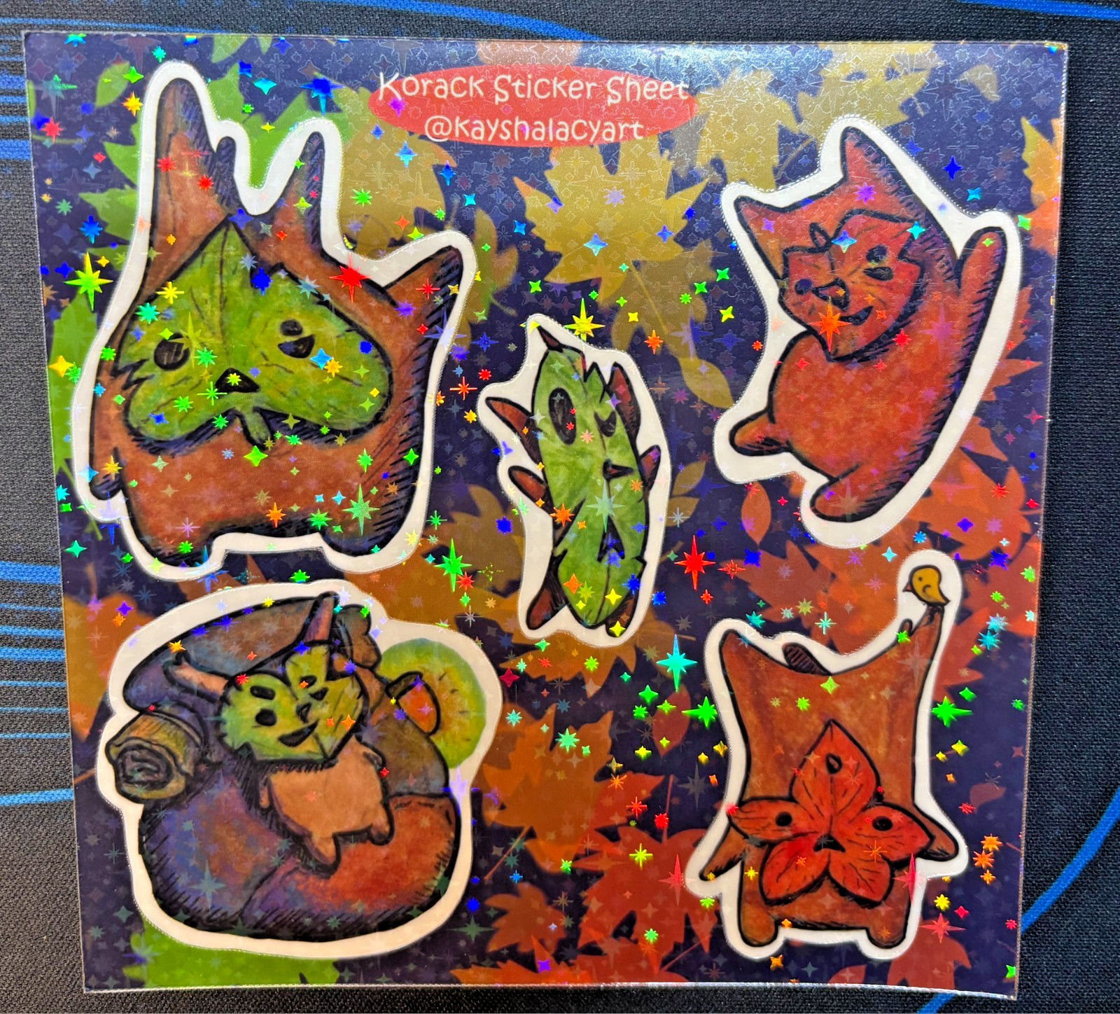 4.5 x 4.5in Korak Sticker Sheet with Five Small Holographic Vinyl Stickers