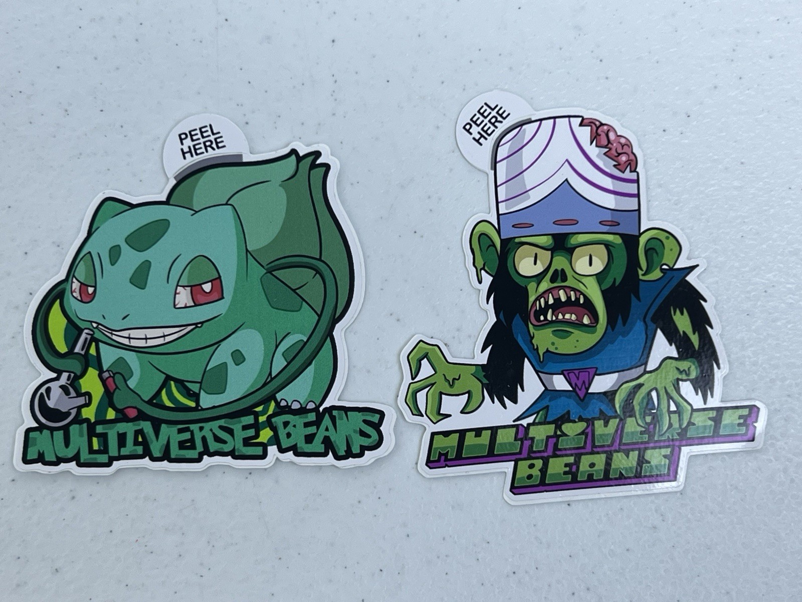 Lot of 2 Stickers Multiverse Beans Bulbasaur Mashup Mojo Jojo Zombie Decal